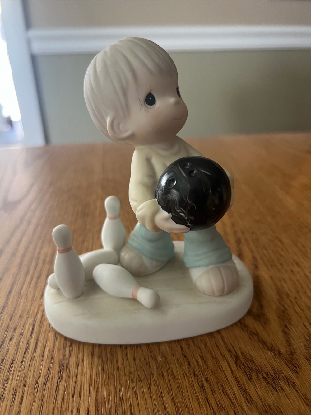 Precious Moments Boy with Black Bowling Ball Figurine - Cream & Light Blue